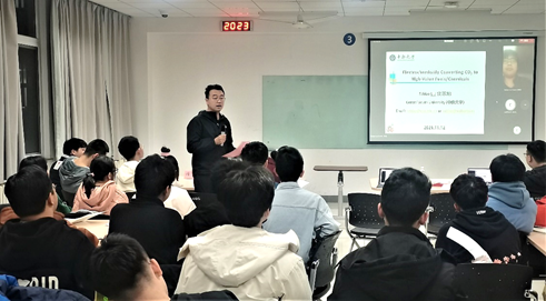 A person giving a presentation to a group of people Description automatically generated with medium confidence